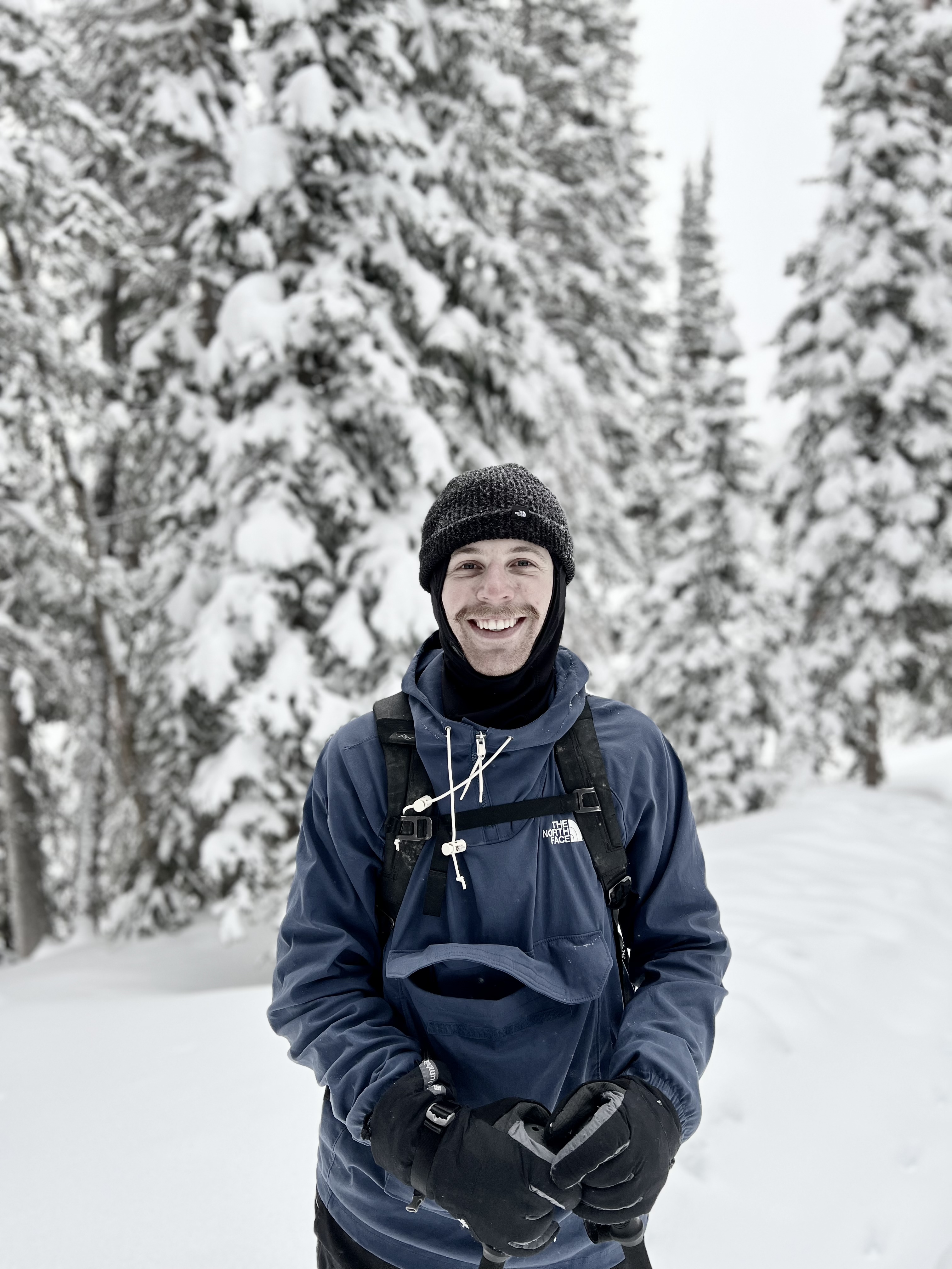 young man (Tanner) standing on a hiking trail